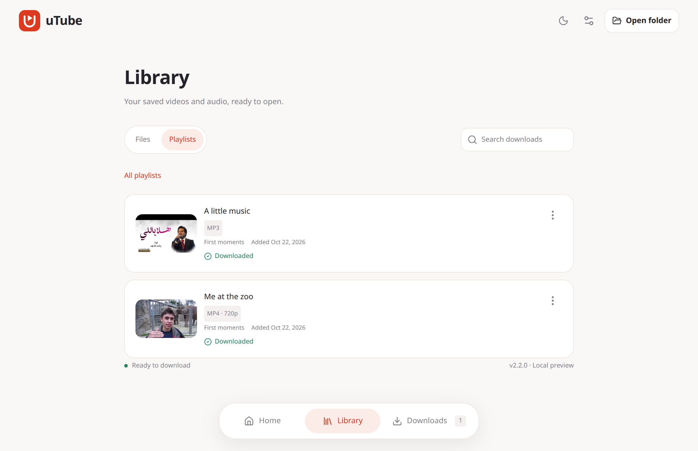 uTube Desktop library with video cards, playlist groups, and the red app theme